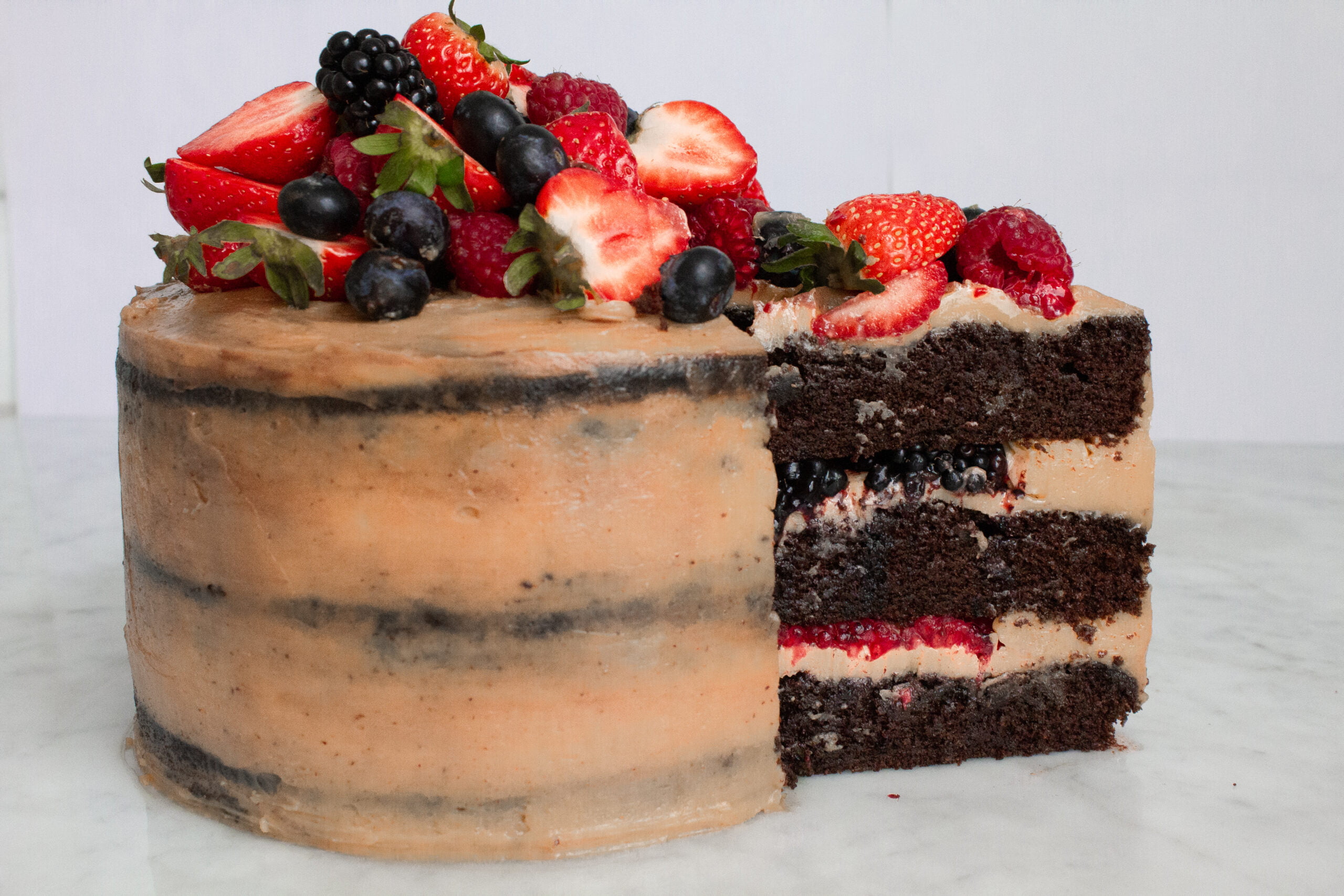 Dulce de leche layer cake with fresh berries